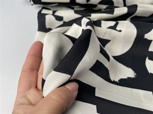 Fastvævet viscose - abstrakt mønster i sort og offwhite